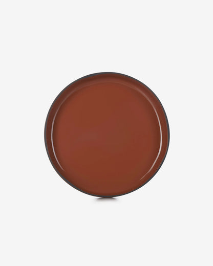 The cinnamon plate straight down from above, the full face and rim in view.