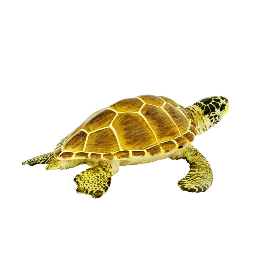 Loggerhead sea turtle figurine facing right on white, the patterned shell seen from the side