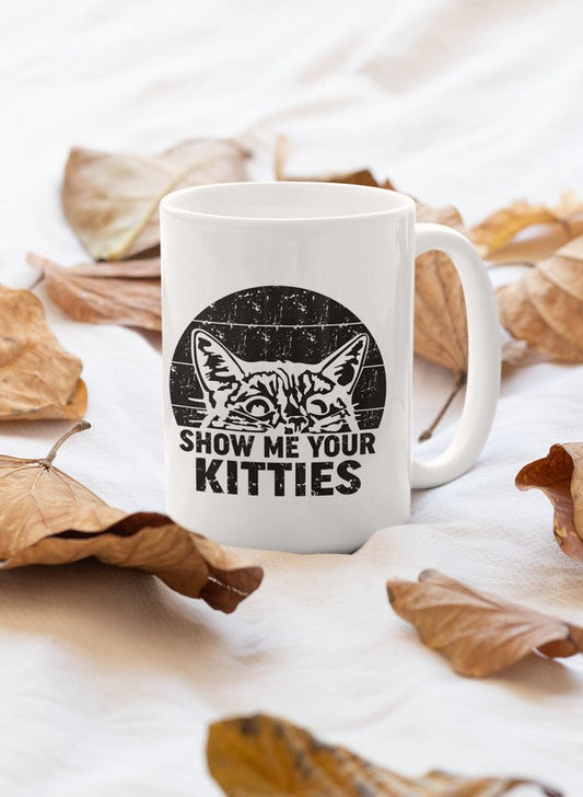 Ceramic coffee mug with a cat-themed printed slogan, fall leaves around it, 11oz size.