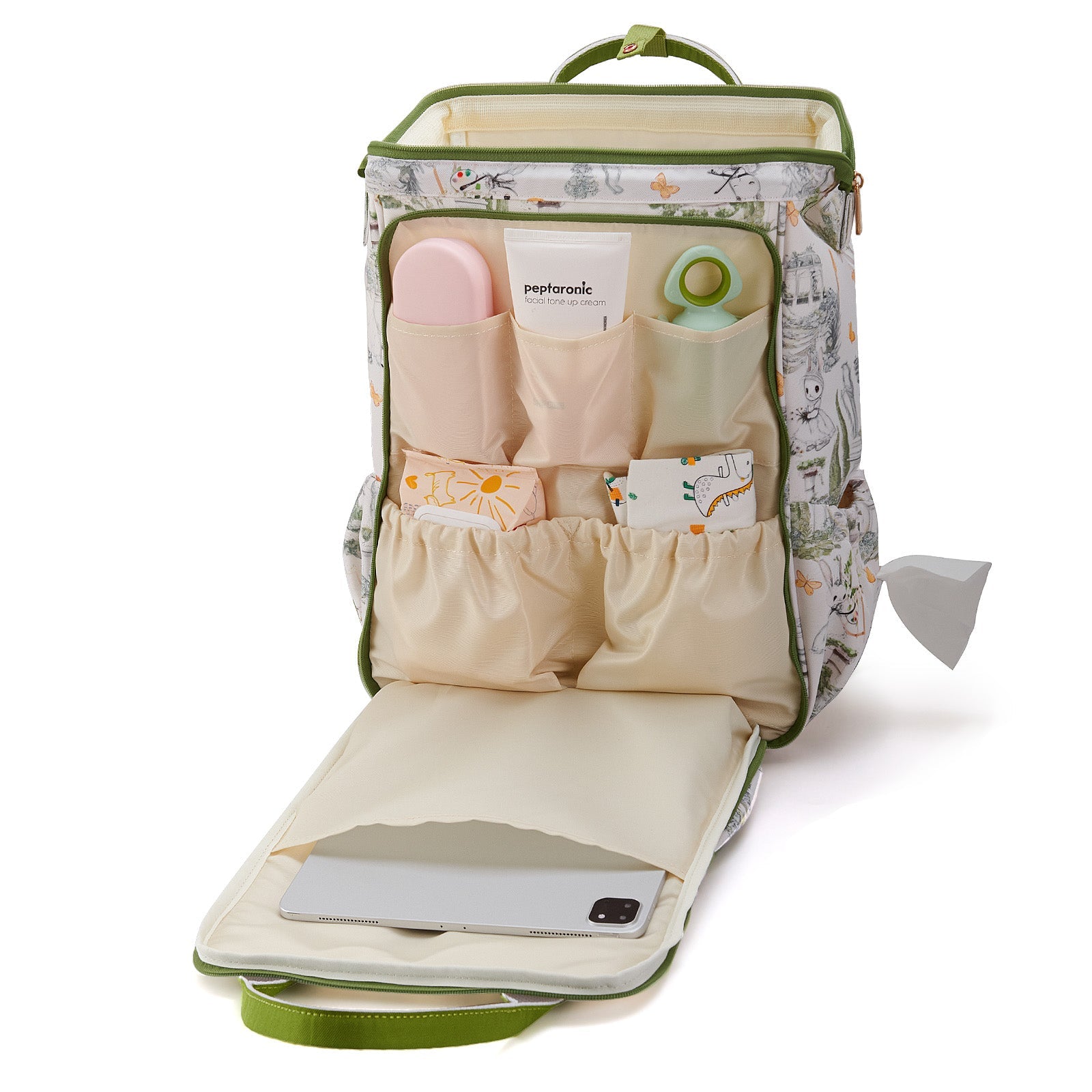 Forest print backpack with the lower compartment unfolded flat, holding a tablet.