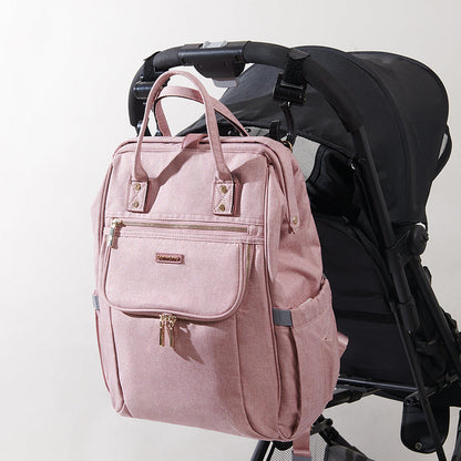Diaper backpack with the D rings for stroller attachment.