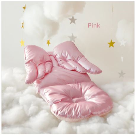 Stroller cushion with a waterproof high gloss face and a cotton reverse.
