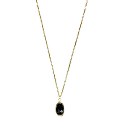 Black quartz pendant necklace on white, a faceted oval stone wrapped in brass on a fine chain