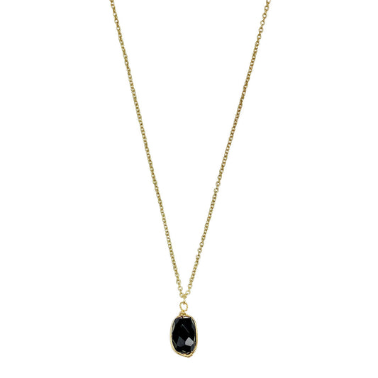 Black quartz pendant necklace on white, a faceted oval stone wrapped in brass on a fine chain