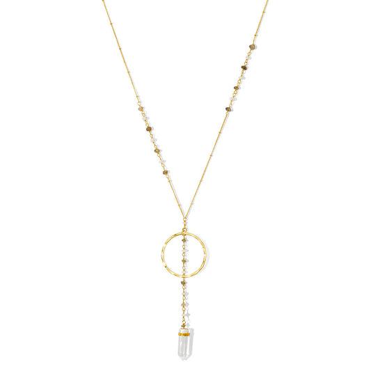 Clear quartz Y necklace on white, a beaded chain, a brass ring and a quartz point at the end