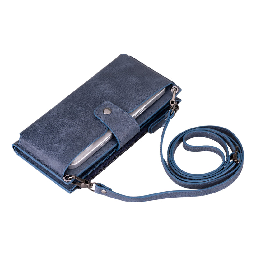 Crossbody phone wallet for women in Navy, a mottled blue leather, with its long strap attached
