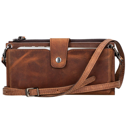Crossbody phone wallet in Antic Brown, a waxy brown leather, with a buckled strap