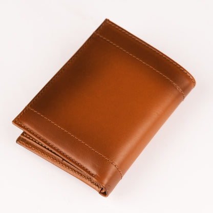 Back of the tan AirTag wallet, a smooth face with a stitched band across the lower edge