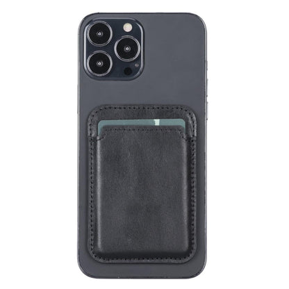 Magnetic leather card holder in black on the back of an iPhone