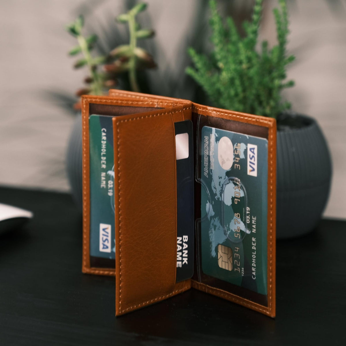 Tan card holder open at another page, its clear sleeves turned to show more cards