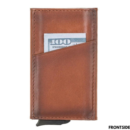 Front of the tan pop up card holder with a bill tucked in the slanted outer pocket