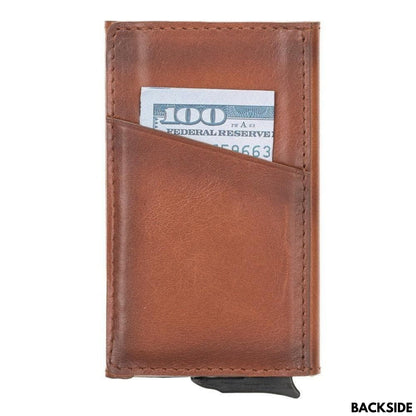 Back of the tan pop up card holder, a second slanted pocket holding a folded bill