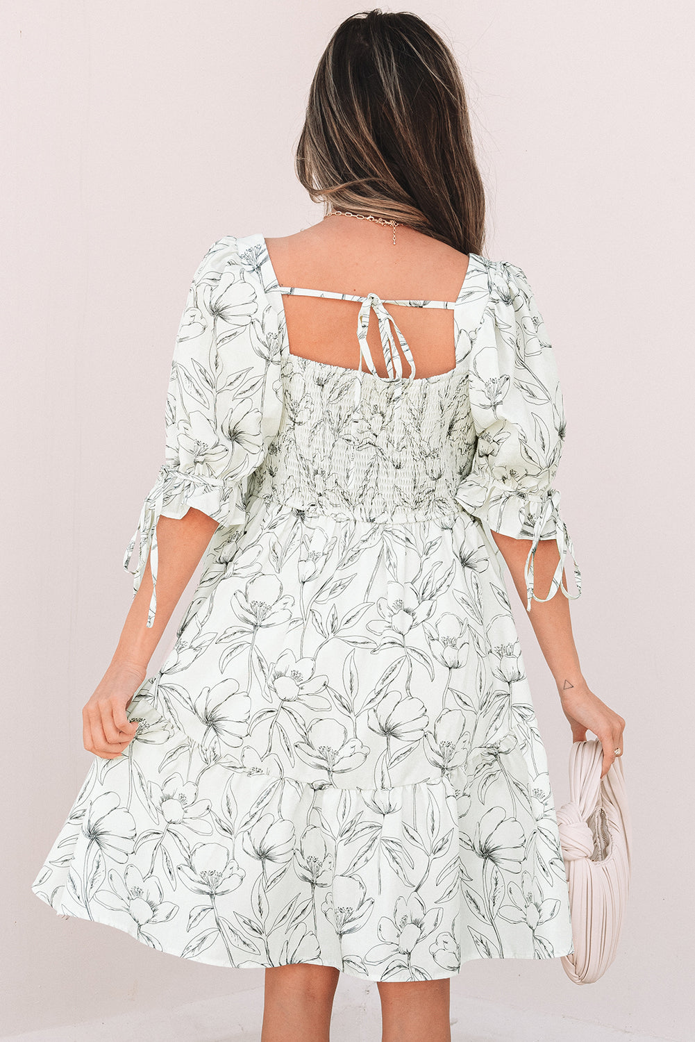 Back of the ivory dress showing the shirred panel and tie