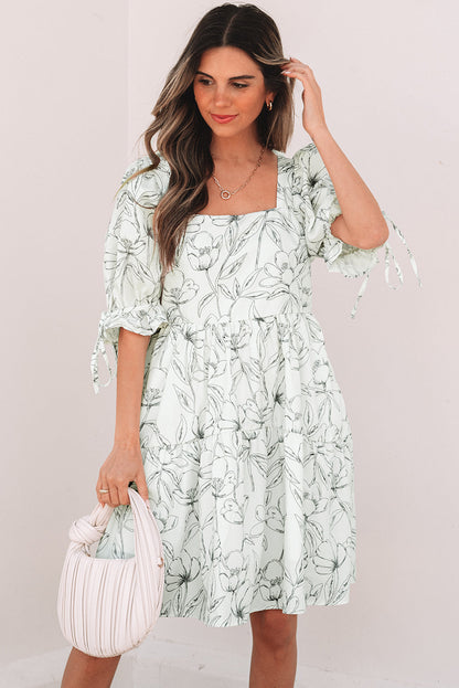 Ivory square neck dress, model with a hand in her hair