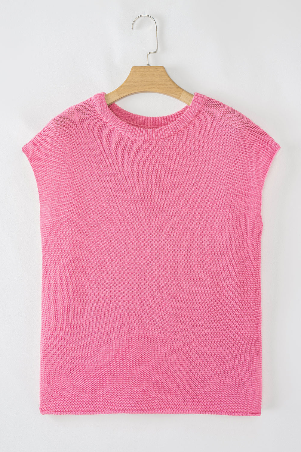 Pink cap sleeve sweater tee on a hanger