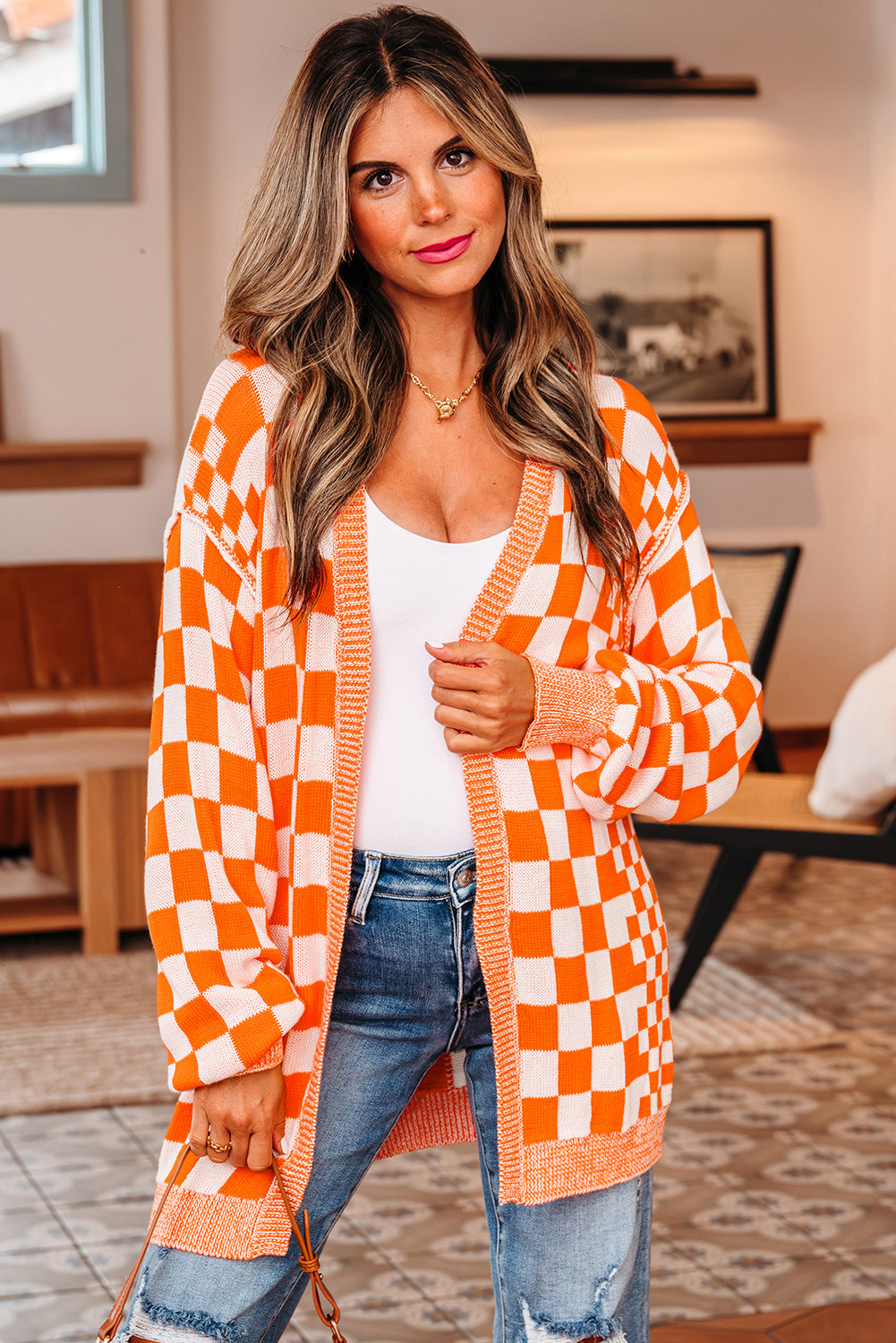 Close front view of the orange checkered cardigan with dropped shoulders
