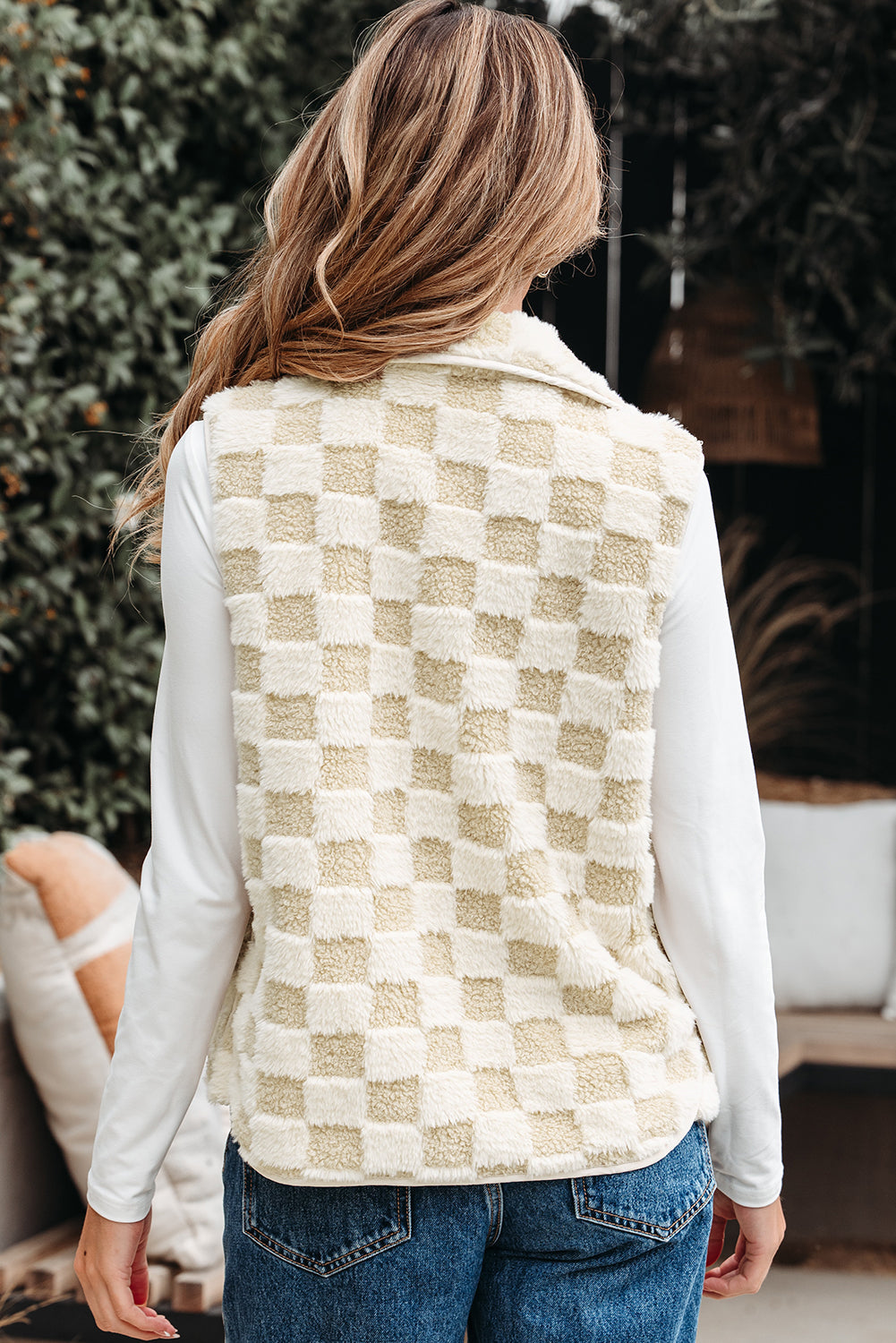 Back view of the checkerboard sherpa vest