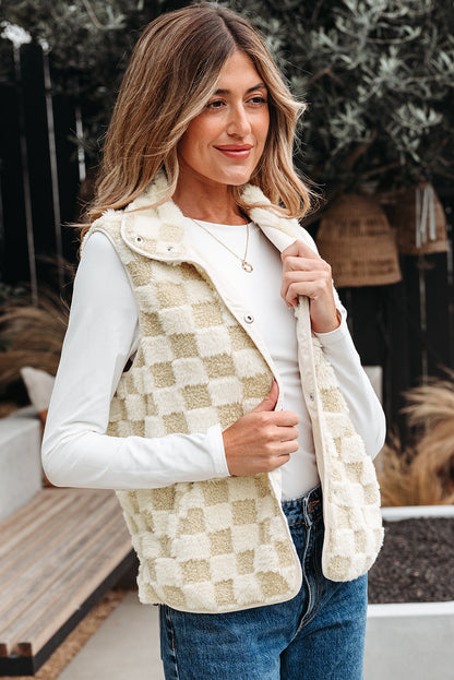 Cream and tan sherpa vest, model holding the stand collar