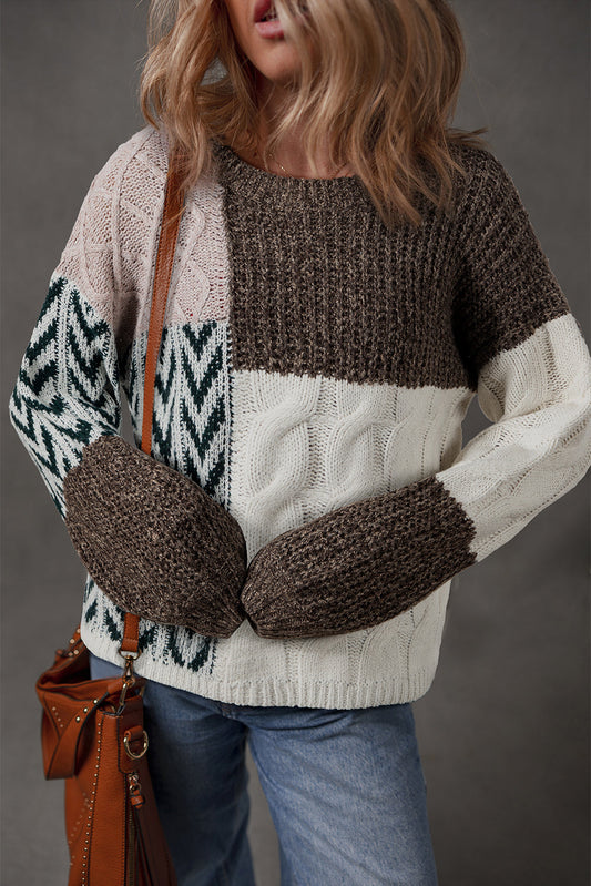 Brown and cream chunky color-block sweater with chevron sleeves and a cognac bag