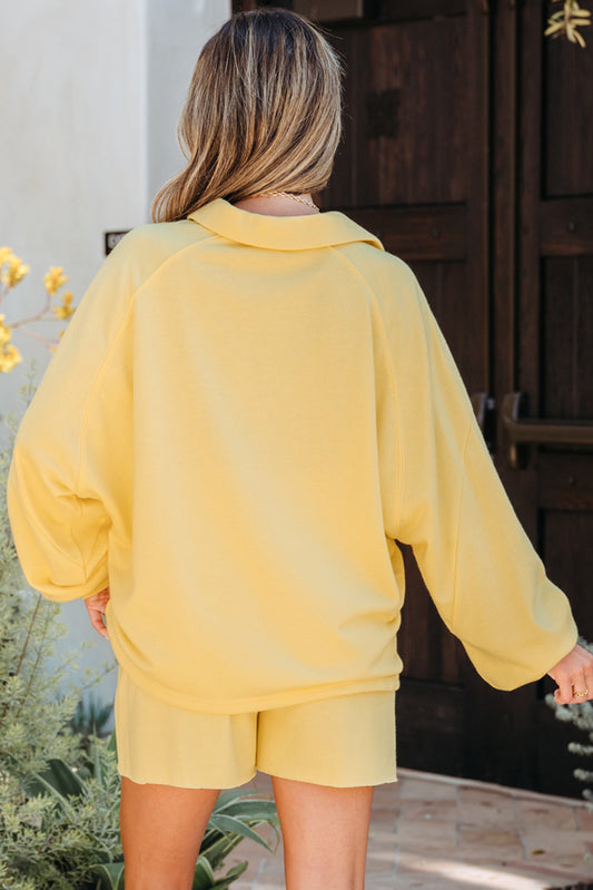 Back view of the pale yellow pullover and shorts set