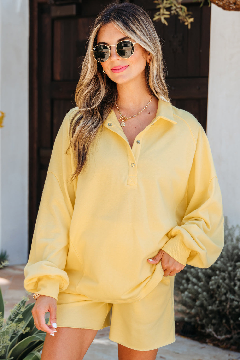 Pale yellow collared sweatshirt set, hand in the pocket