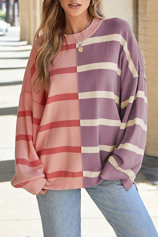 Pink and mauve color-block striped sweater with jeans, front view