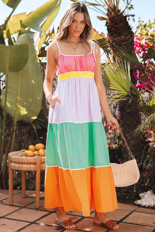Pink, lilac, mint and orange color-block maxi dress with a straw bag