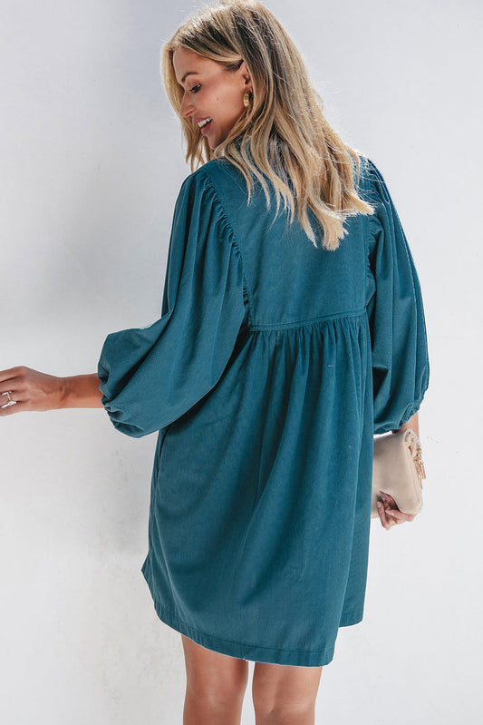 Back view of the teal corduroy babydoll dress