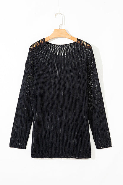 Black crochet open-knit sweater on a hanger