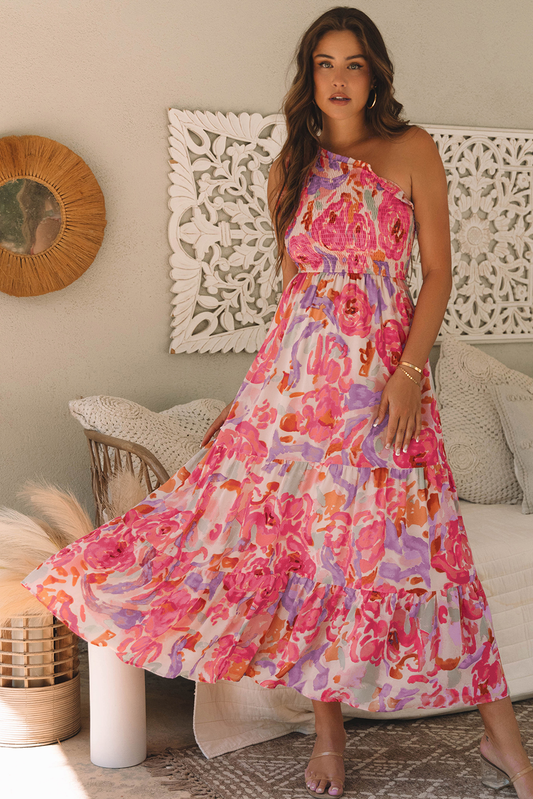 Pink floral one-shoulder maxi dress, model holding out the skirt