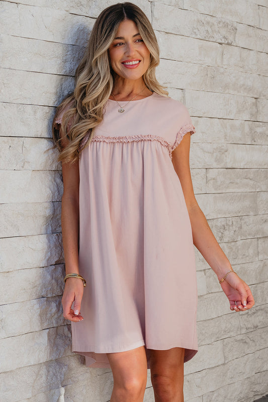 Blush babydoll mini dress with frill trim, front view