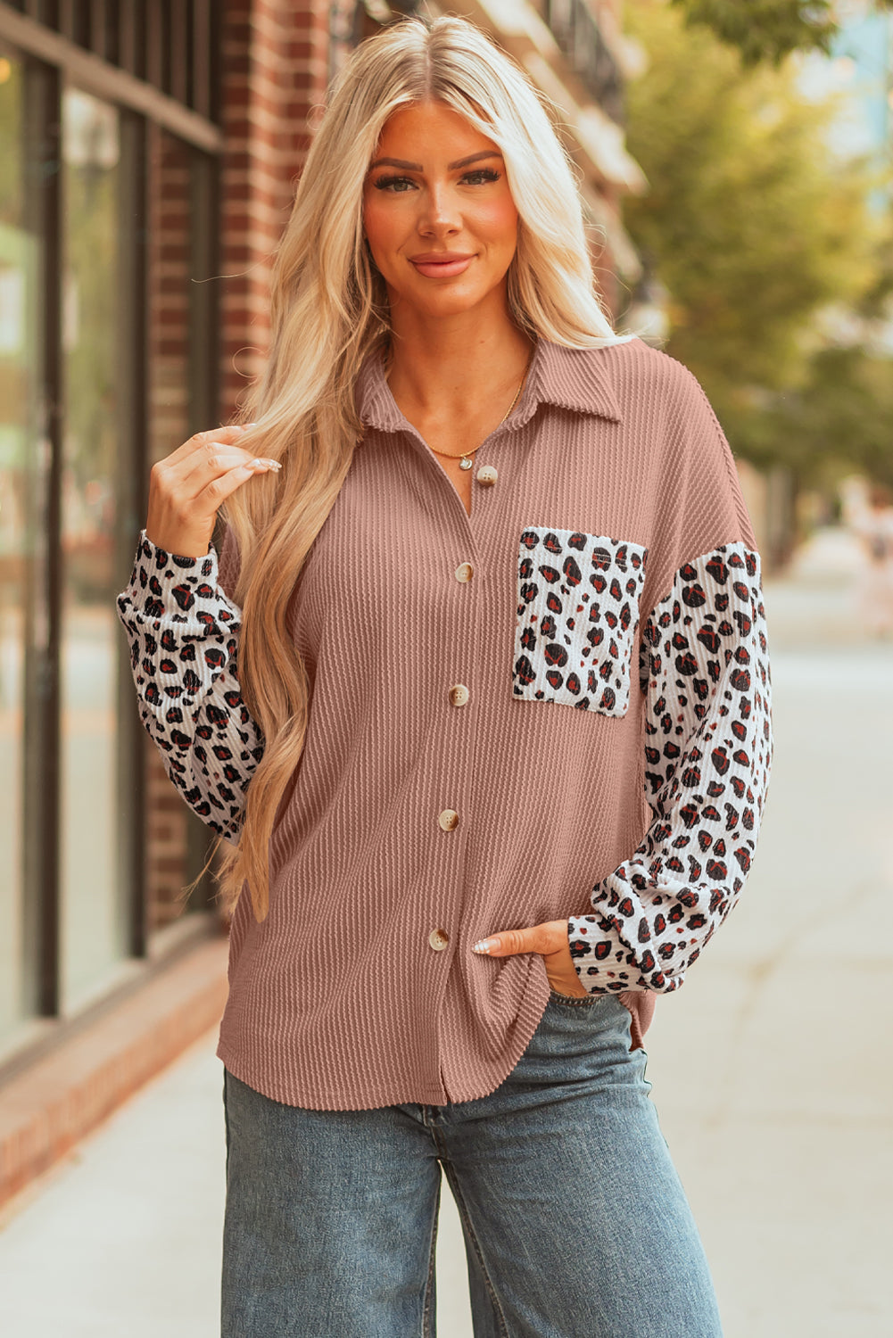 Mauve ribbed shacket worn over jeans, hand in the pocket