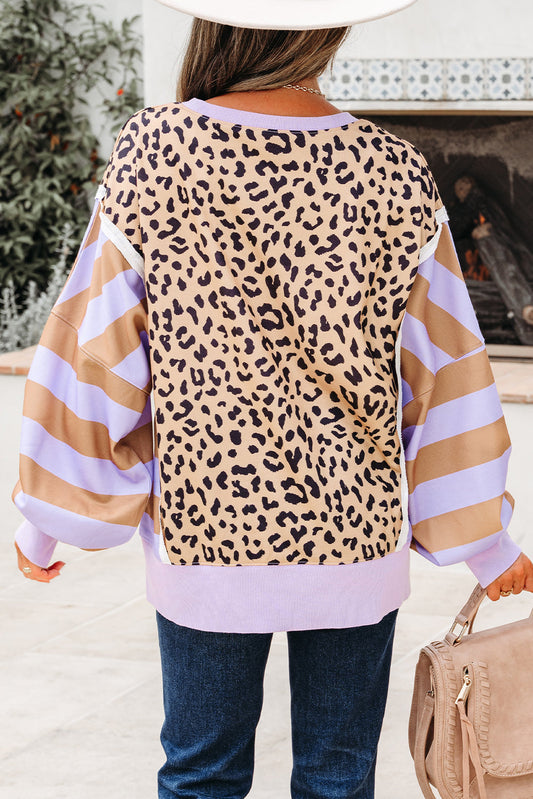 Back view of the leopard sweatshirt with striped balloon sleeves