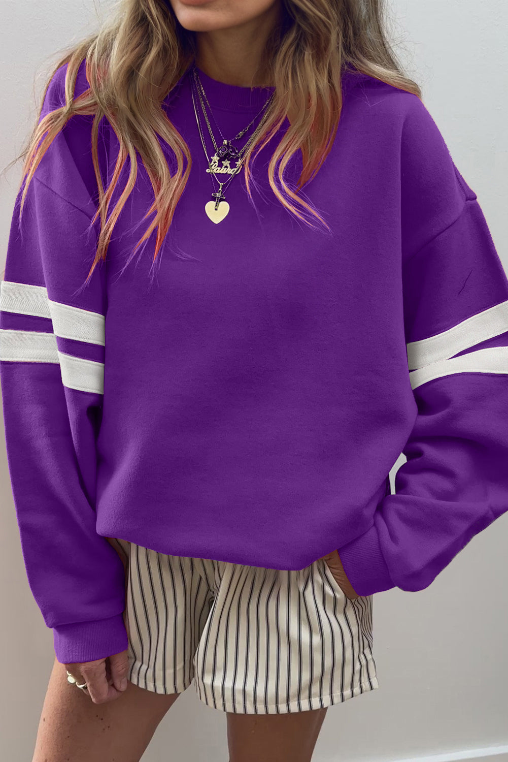 Purple varsity stripe sweatshirt with striped shorts