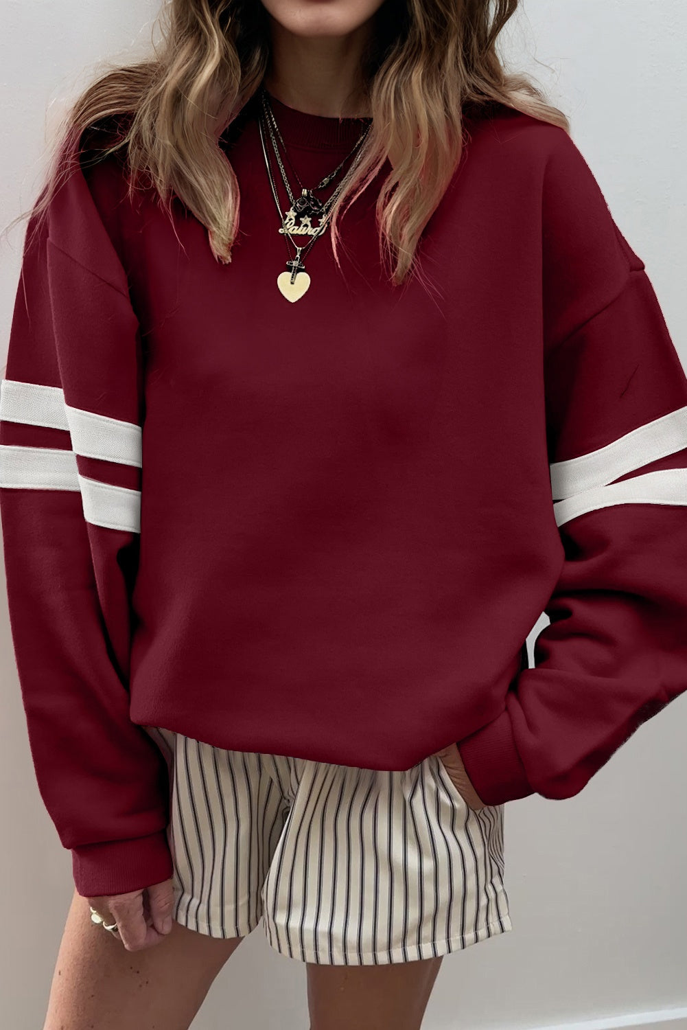 Burgundy varsity stripe sweatshirt with striped shorts