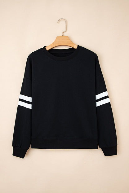 Black varsity stripe sweatshirt on a hanger, front view