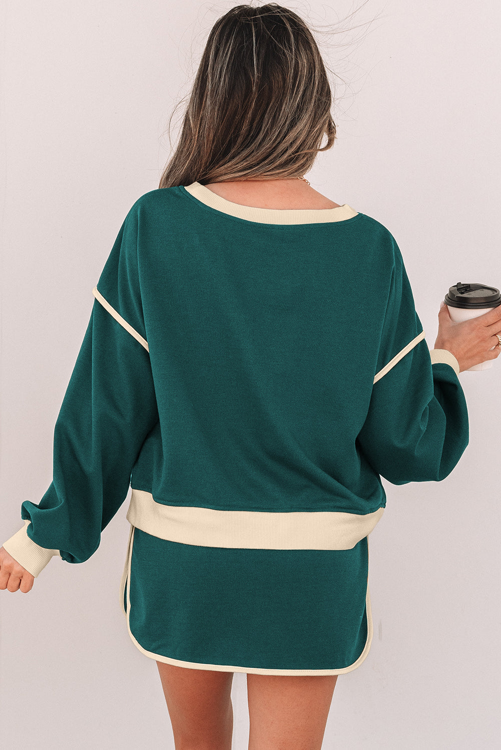 Back view of the evergreen pullover and drawstring skort set