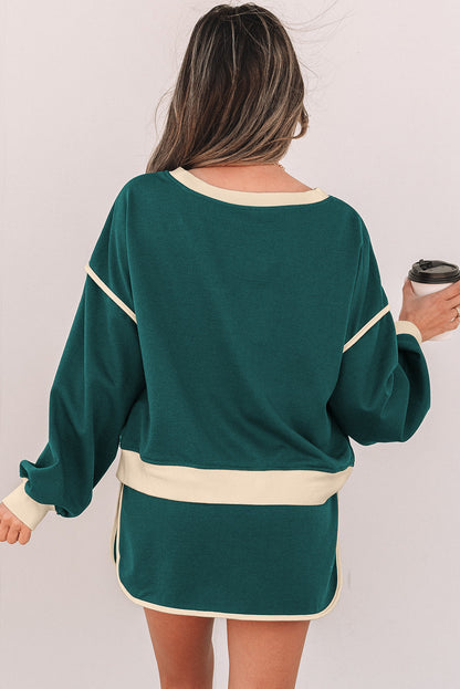 Back view of the evergreen pullover and drawstring skort set