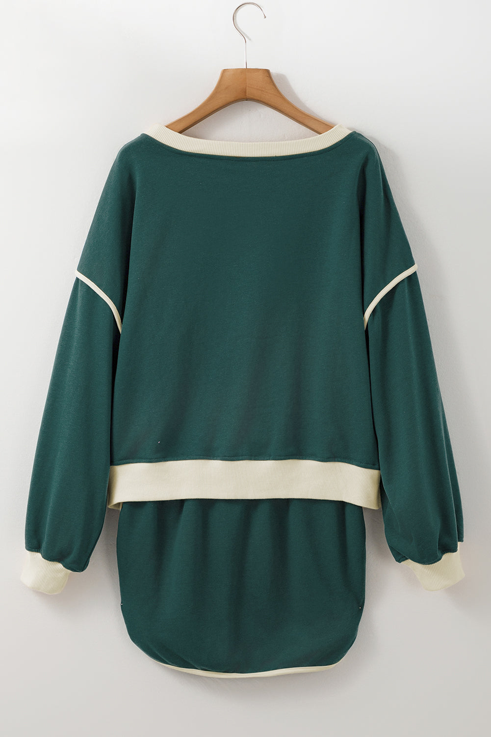 Evergreen pullover and skort set on a hanger, back view