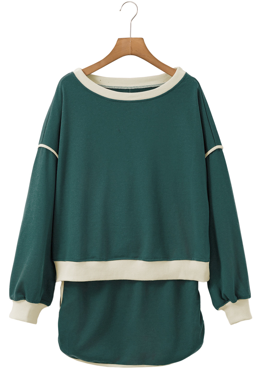 Evergreen pullover and skort set on a hanger, front view with cream trim