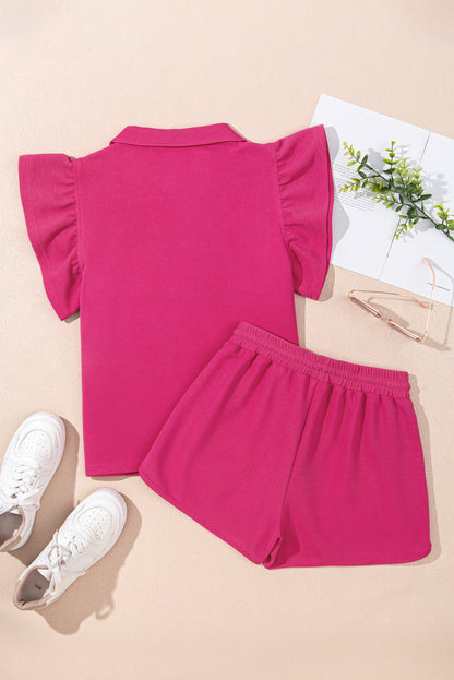 Hot pink flutter sleeve top and shorts laid flat, back view