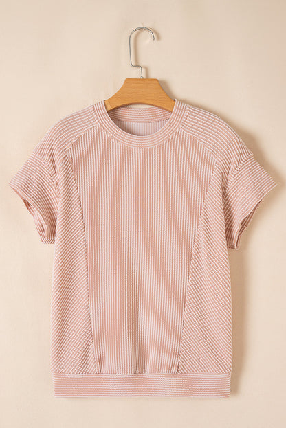 Blush pink ribbed knit tee on a hanger