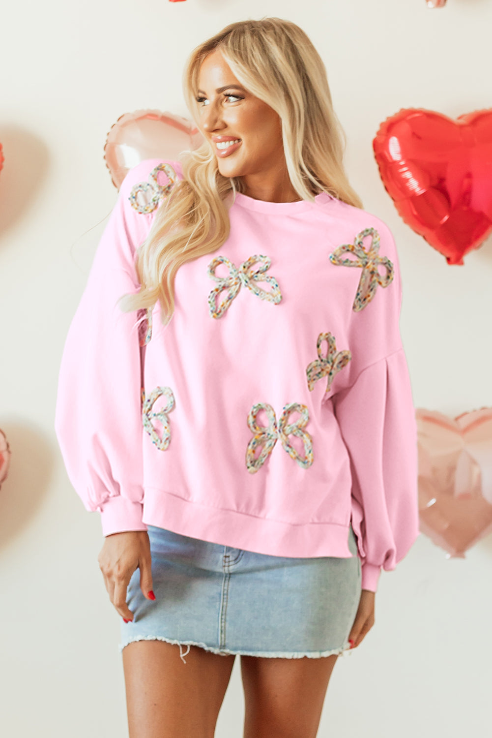 Light pink sequin bow sweatshirt, front view