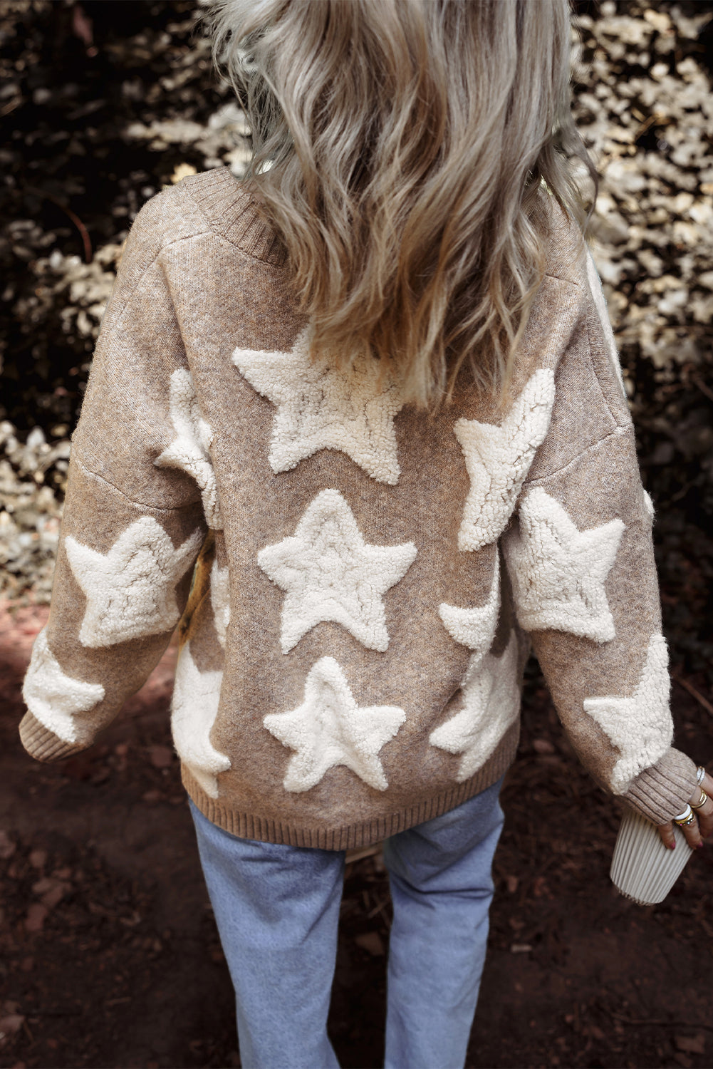 Back of the khaki cardigan showing the cream sherpa stars across the shoulders