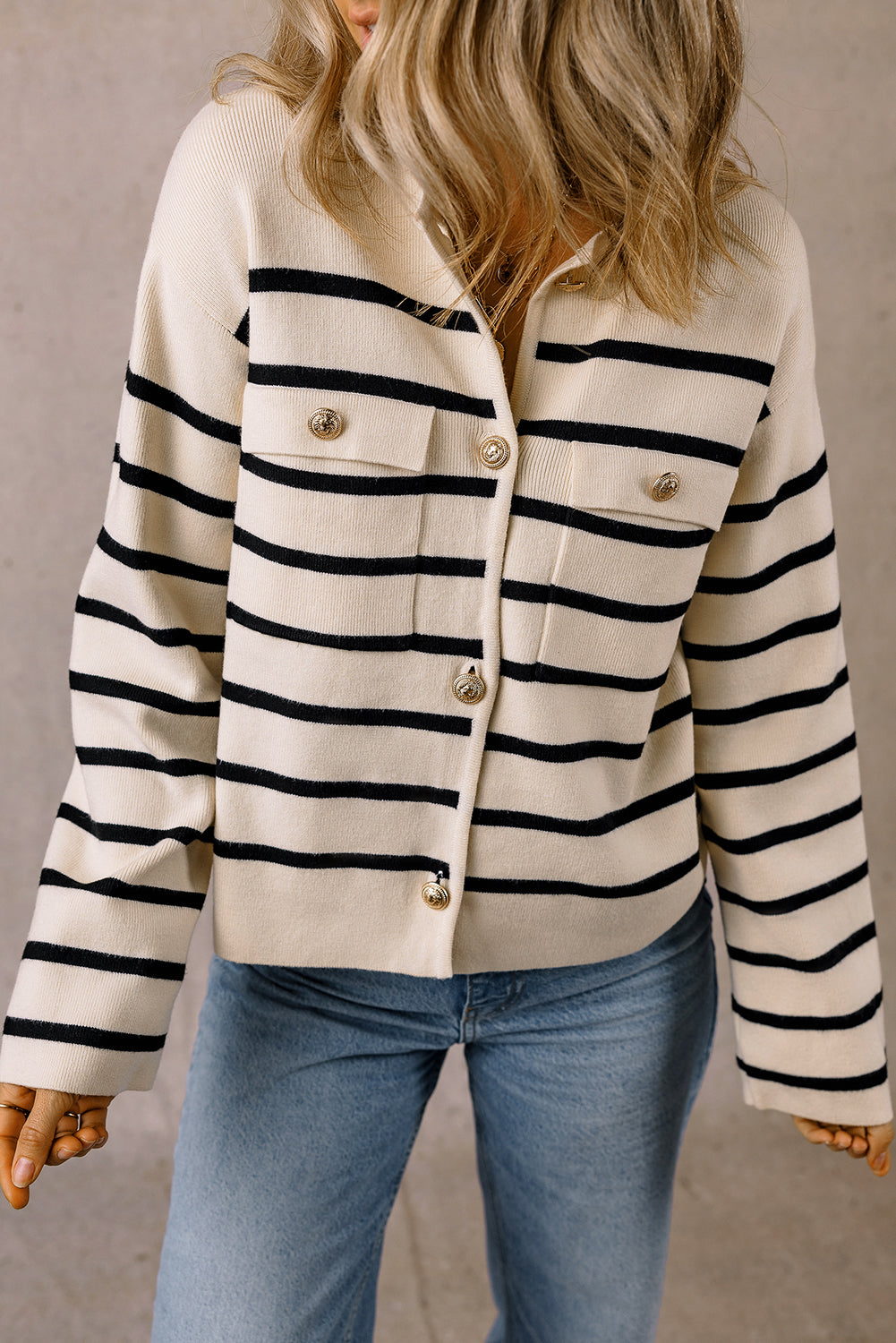 Cream and black striped button cardigan with flap pockets and jeans