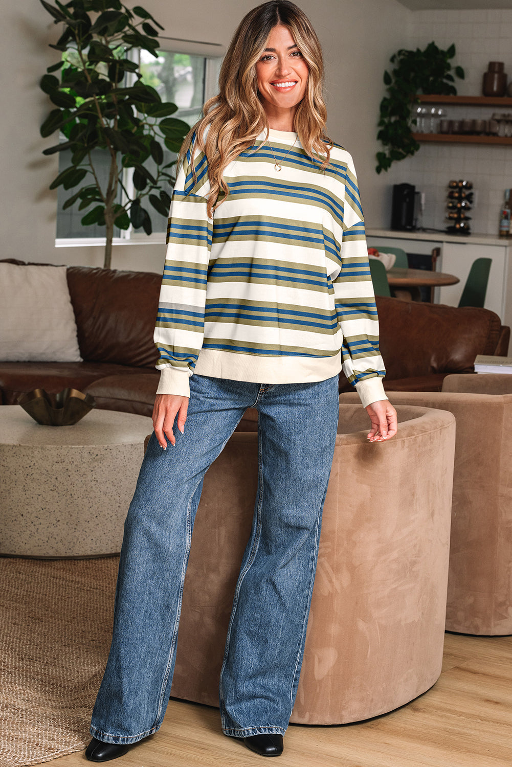 Striped crewneck sweatshirt with jeans, full length front view