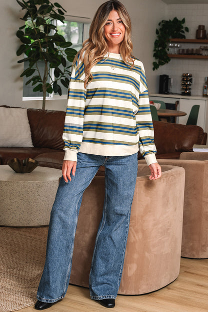 Striped crewneck sweatshirt with jeans, full length front view