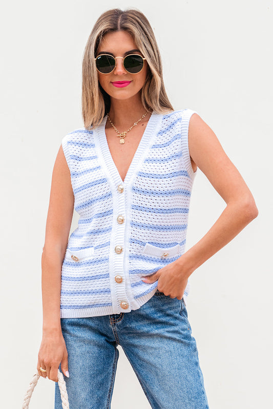 White and blue striped sweater vest with gold buttons, worn with jeans, front view
