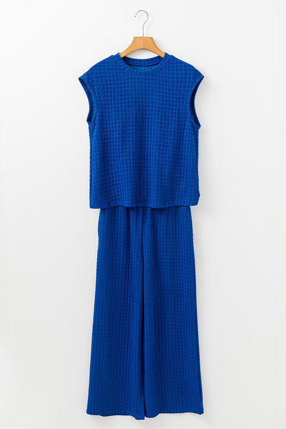 Royal blue waffle knit top and wide-leg pants set on a hanger