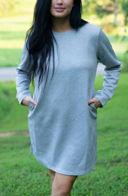 Heather gray textured long sleeve shift dress, hands in pockets, front view
